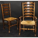 A set of twelve assorted 19th Century oak ladder back dining chairs including four carvers with