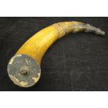 An inscribed cow horn flask, the spout carved with rings and faceted panels,