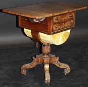A 19th Century flamed mahogany work table with drop leaves,