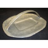 An Archibald Knox for Liberty & Co pewter cake tray of basket form cast with stylised Honesty No