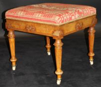 A Victorian walnut dressing stool in the Gothic Revival taste,