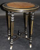 A Victorian ebonised and amboyna occasional table,