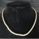 A 14 carat gold bi-coloured rope twist necklace,