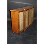 A Regency rosewood breakfront side cabinet with two pairs of brass wirework and silk panelled doors,