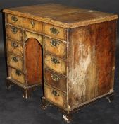 An early 18th Century walnut kneehole desk,
