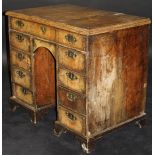 An early 18th Century walnut kneehole desk,