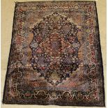 A fine silk Kashan rug,