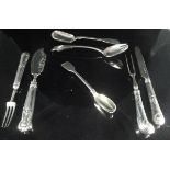 A collection of silver forks,