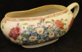 A 19th Century Chinese famille rose bourdaloue with all over floral spray decoration in enamels