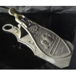 A Victorian and embossed letter clip by Merry,