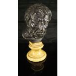 A bronze bust of Seneca mounted on a Siena marble base,