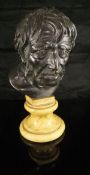 A bronze bust of Seneca mounted on a Siena marble base,