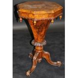 A Victorian walnut trumpet-shaped work table, the octagonal burr top with centre medallion,