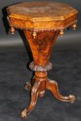 A Victorian walnut trumpet-shaped work table, the octagonal burr top with centre medallion,