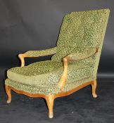 A pair of early 20th Century fruitwood armchairs of Louis XV style with outswept arms and cabriole