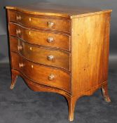 A Regency mahogany and inlaid serpentine chest of drawers,