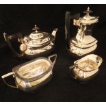 A George V silver four piece tea set comprising teapot, twin-handled sucrier,