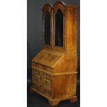 An early 18th Century walnut bureau cabinet,