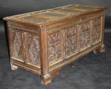A circa 1700 oak coffer with four panels to the lid with zigzag and dot relief carving to the edges,