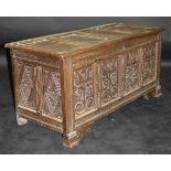 A circa 1700 oak coffer with four panels to the lid with zigzag and dot relief carving to the edges,