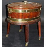 A George III mahogany and brass bound oval wine cooler with twin handles,