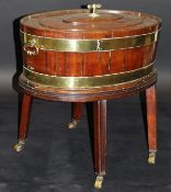 A George III mahogany and brass bound oval wine cooler with twin handles,