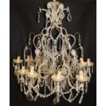 A cut and beaded glass brass mounted twelve branch electrolier in the Italianate taste,