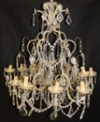 A cut and beaded glass brass mounted twelve branch electrolier in the Italianate taste,