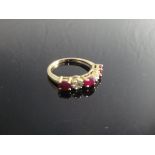 An 18 carat gold ruby and diamond set dress ring,