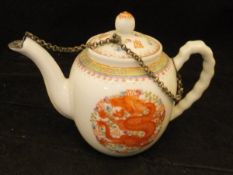 A Chinese miniature teapot with five toed dragon and phoenix medallion decoration,