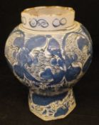 An 18th Century tin glazed pottery vase of baluster octagonal form,