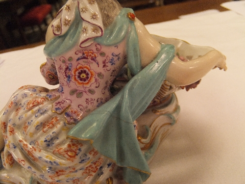 A pair of 19th Century Meissen figures as a recumbent gentleman and lady with baskets of flowers, - Image 36 of 48