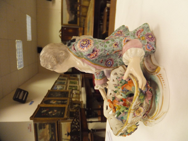 A pair of 19th Century Meissen figures as a recumbent gentleman and lady with baskets of flowers, - Image 5 of 48