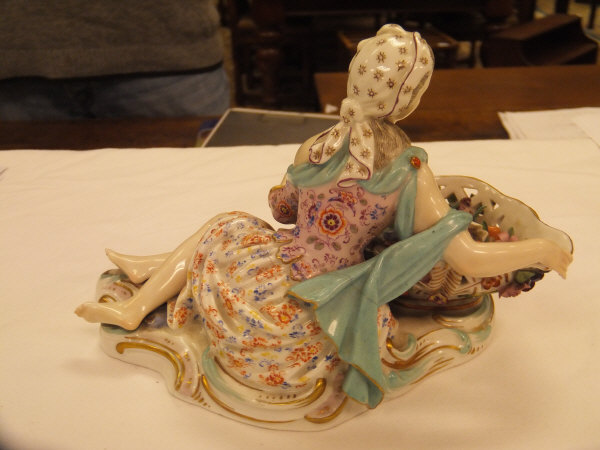 A pair of 19th Century Meissen figures as a recumbent gentleman and lady with baskets of flowers, - Image 26 of 48