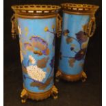 A pair of 19th Century French polychrome glazed pottery vases by Creil & Montereau decorated in