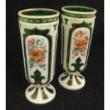 A pair of Victorian Bohemian overlaid green glass vases decorated with a fox and cat,