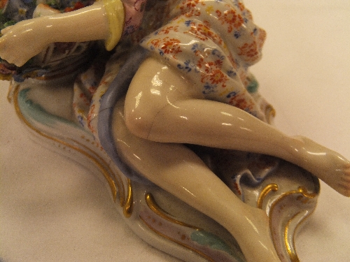 A pair of 19th Century Meissen figures as a recumbent gentleman and lady with baskets of flowers, - Image 33 of 48