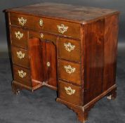 An 18th Century fruitwood kneehole desk,
