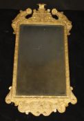 A George I giltwood and gesso framed wall mirror,