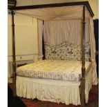 A George III style mahogany full tester bedstead with drapes, the end posts of reeded tapering form,