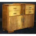 A 1920's French Art Deco walnut veneered cabinet by Dominique of Paris,