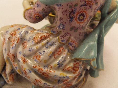 A pair of 19th Century Meissen figures as a recumbent gentleman and lady with baskets of flowers, - Image 34 of 48