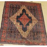 A Persian style rug,