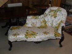 A Victorian chaise longue with button back and glazed floral upholstery,