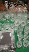 Four glass decanters, five Dartington wine glasses, assorted brandy glasses, tumblers,