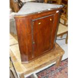A 19th Century Oak wall hanging corner cupboard with single door opening to reveal fitted interior