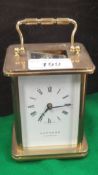 A modern brass cased carriage clock, the movement by Matthew Norman of Switzerland, No'd.