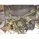 A set of brass fireside tools, firedogs, door porter, folding brass fire screen,