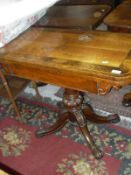 A Victorian mahogany and walnut cross banded fold-over card table on centre pedestal to splayed