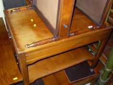 A yew wood two tier tea trolley, a two tier conservatory table,